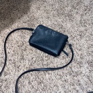 Over shoulder purse with built in card holders.